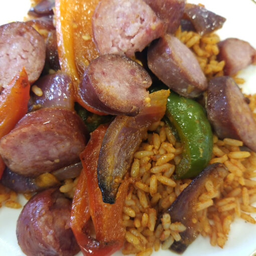 Smoked Sausage w/ Peppers & Onions over Red Rice